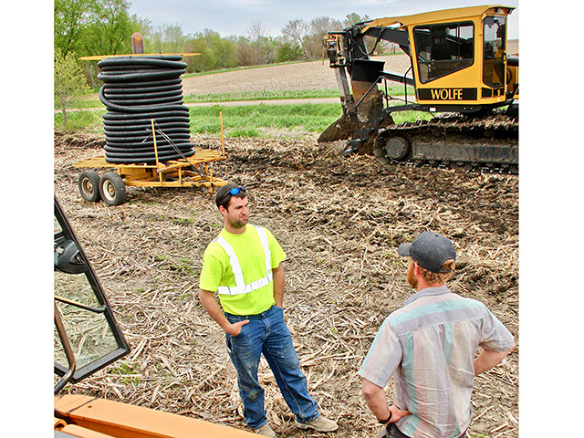 Brothers Jacob, left, and Brian Handsaker diversified their operation with excavation and drainage tile work, Image by Des Keller
